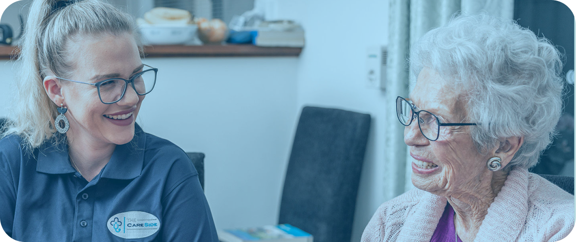 Aged care worker providing personal care to senior woman