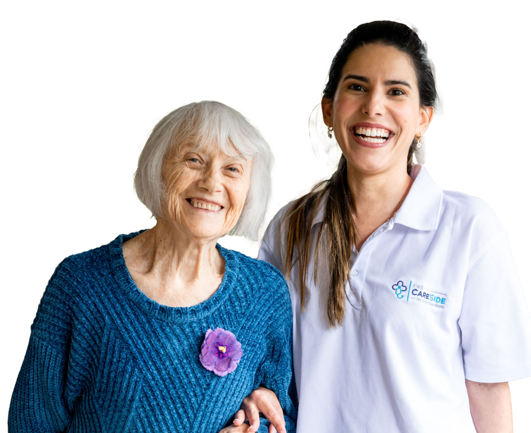 Smiling home care client poses for a photo alongside her friendly caregiver from The CareSide.