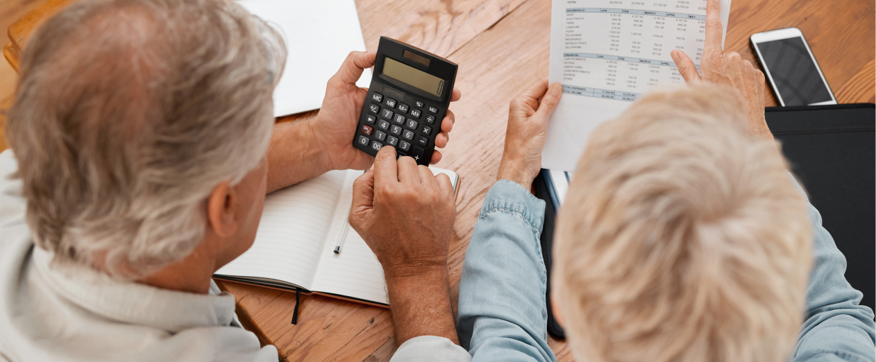 couple calculating costs of transferring home care package