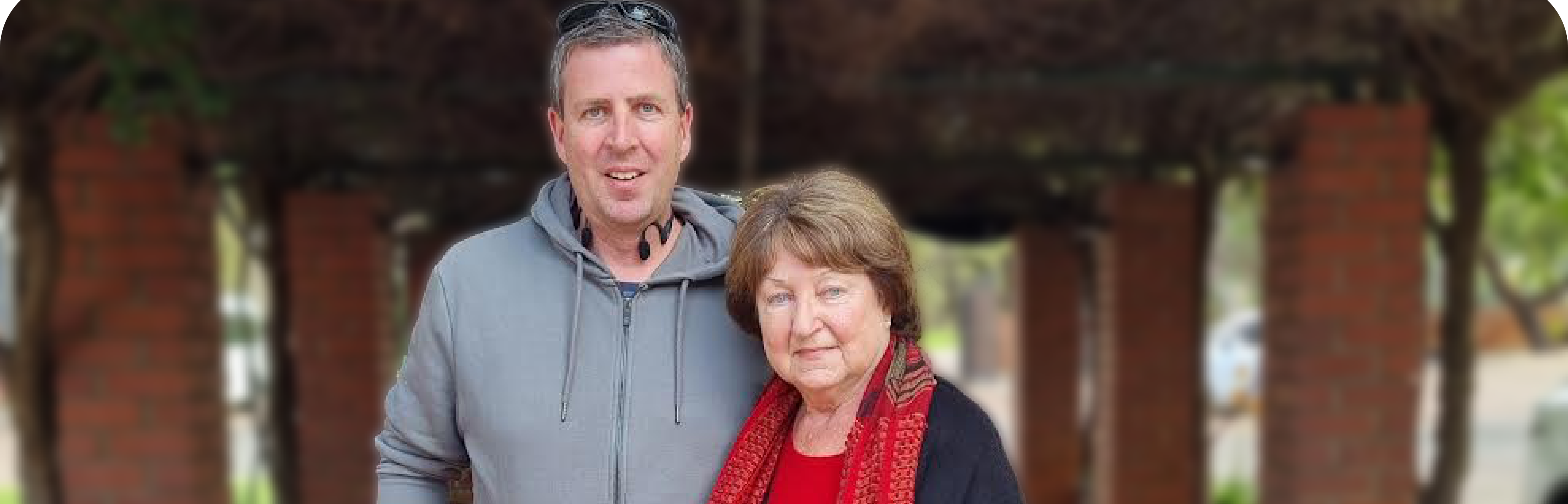 Heidi and her son, Alex, smile for a photo while discussing how The CareSide has delivered the best companion care from day one.