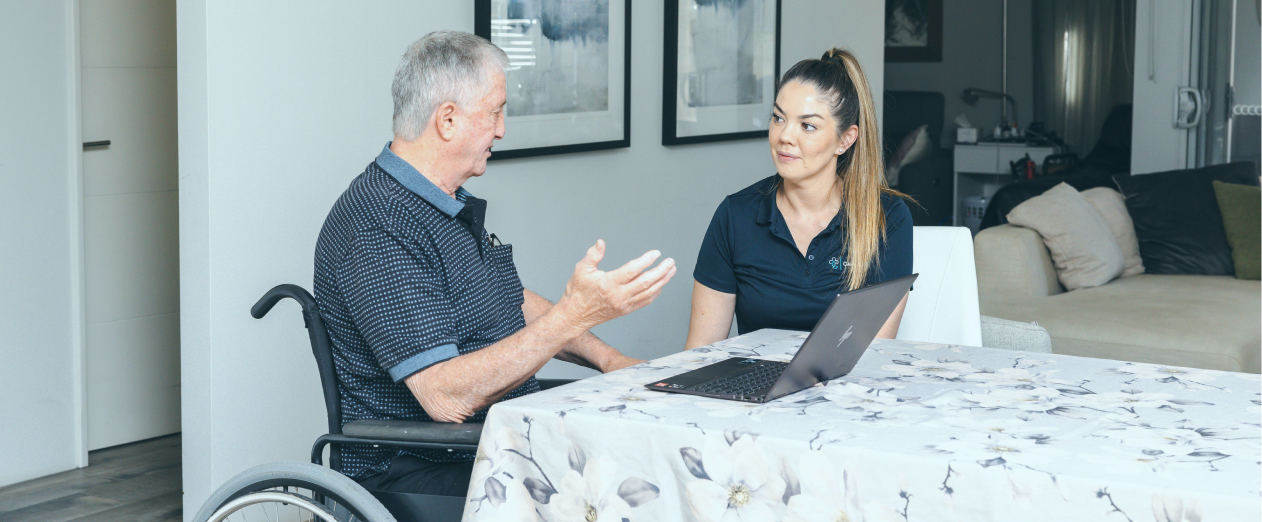 A man discusses his NDIS Core Support budget with his caregiver.