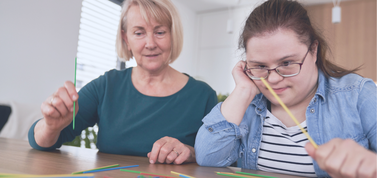 A young girl works with a psychologist as part of her NDIS Improved Relationships funding.