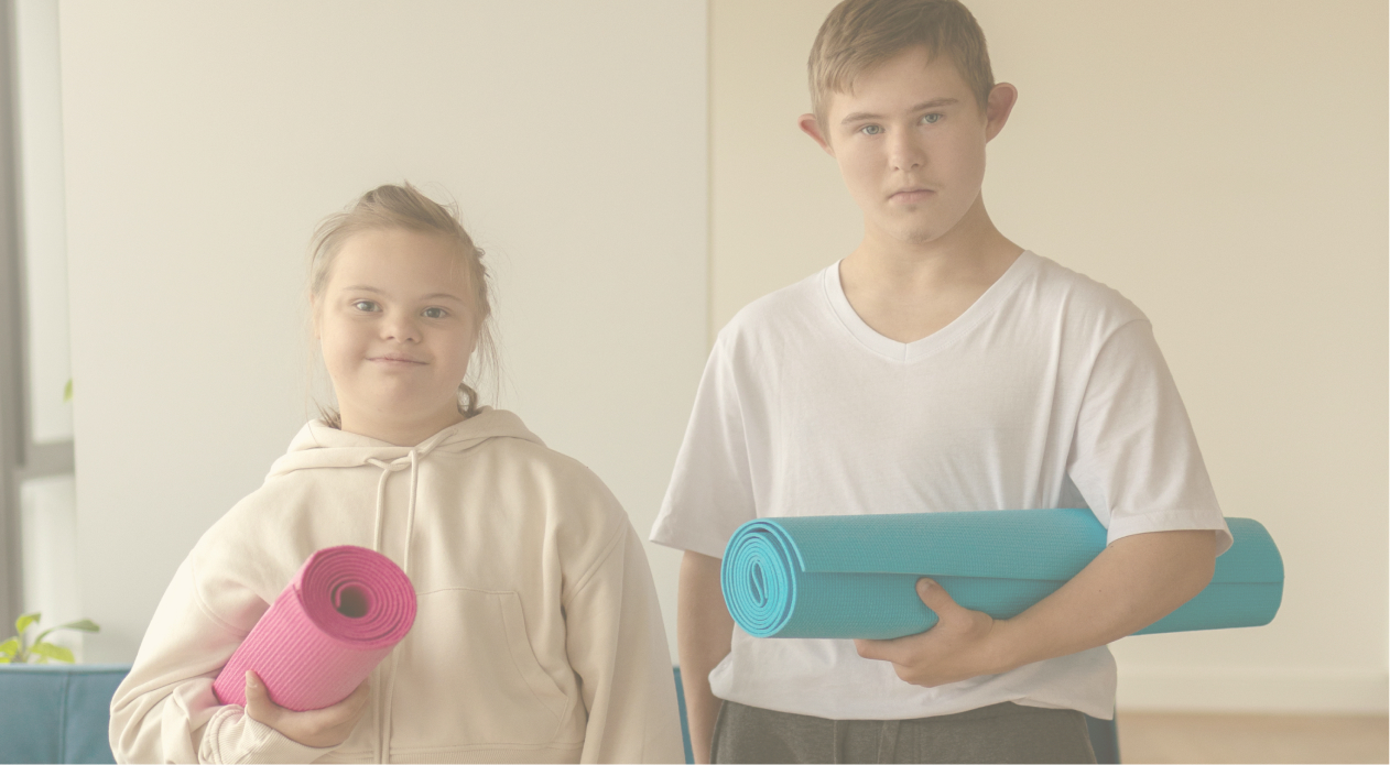 Children hold yoga mats during an exercise class.