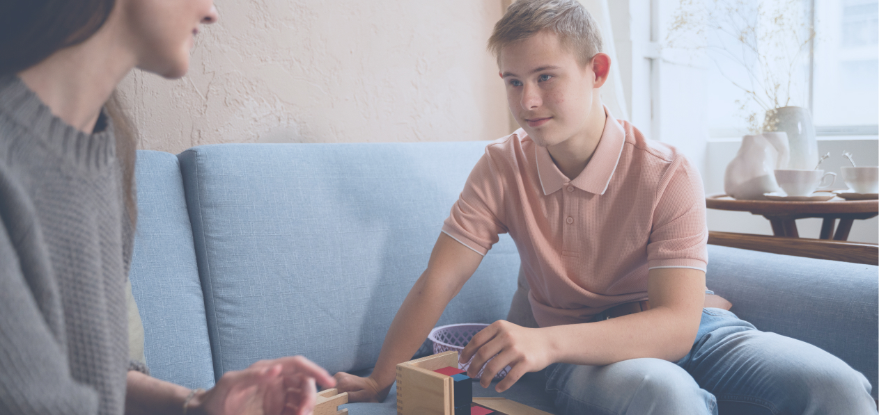 Photo of a boy playing with toys.