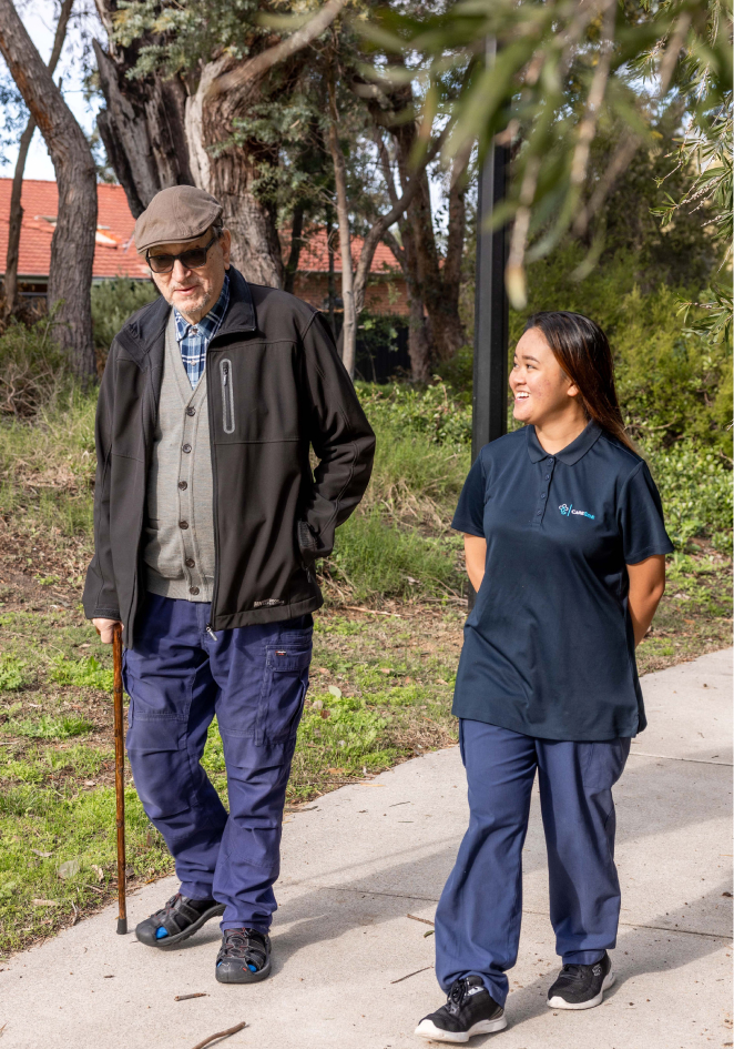 A caregiver from The CareSide provides home care in Adelaide while walking alongside her client on a sunny day.