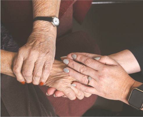 Numerous hands affectionately touching each other in a show of support.